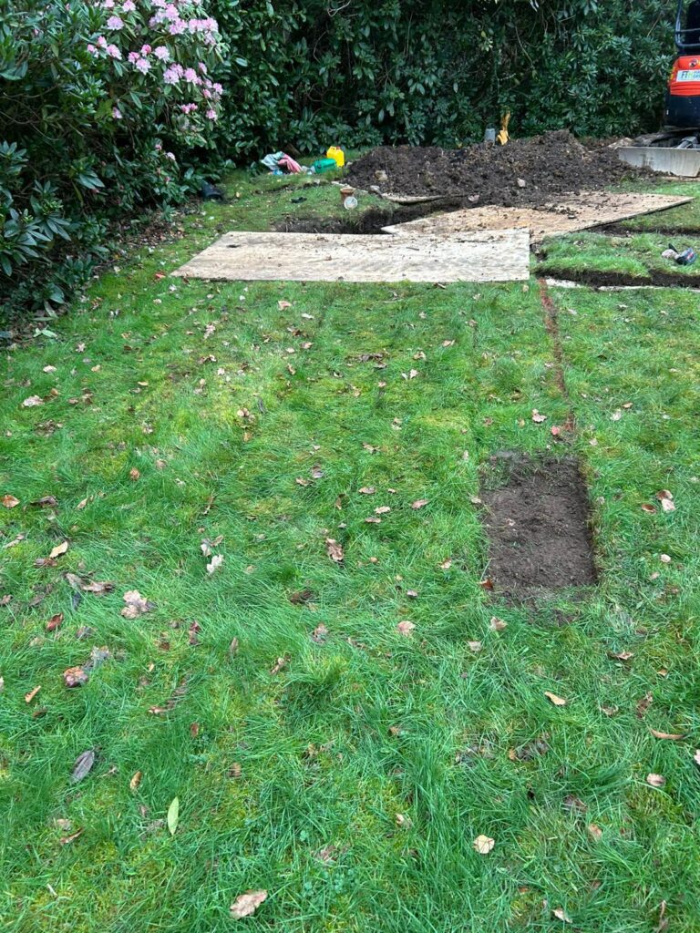 Garden excavation for underground drainage repair in Dorset