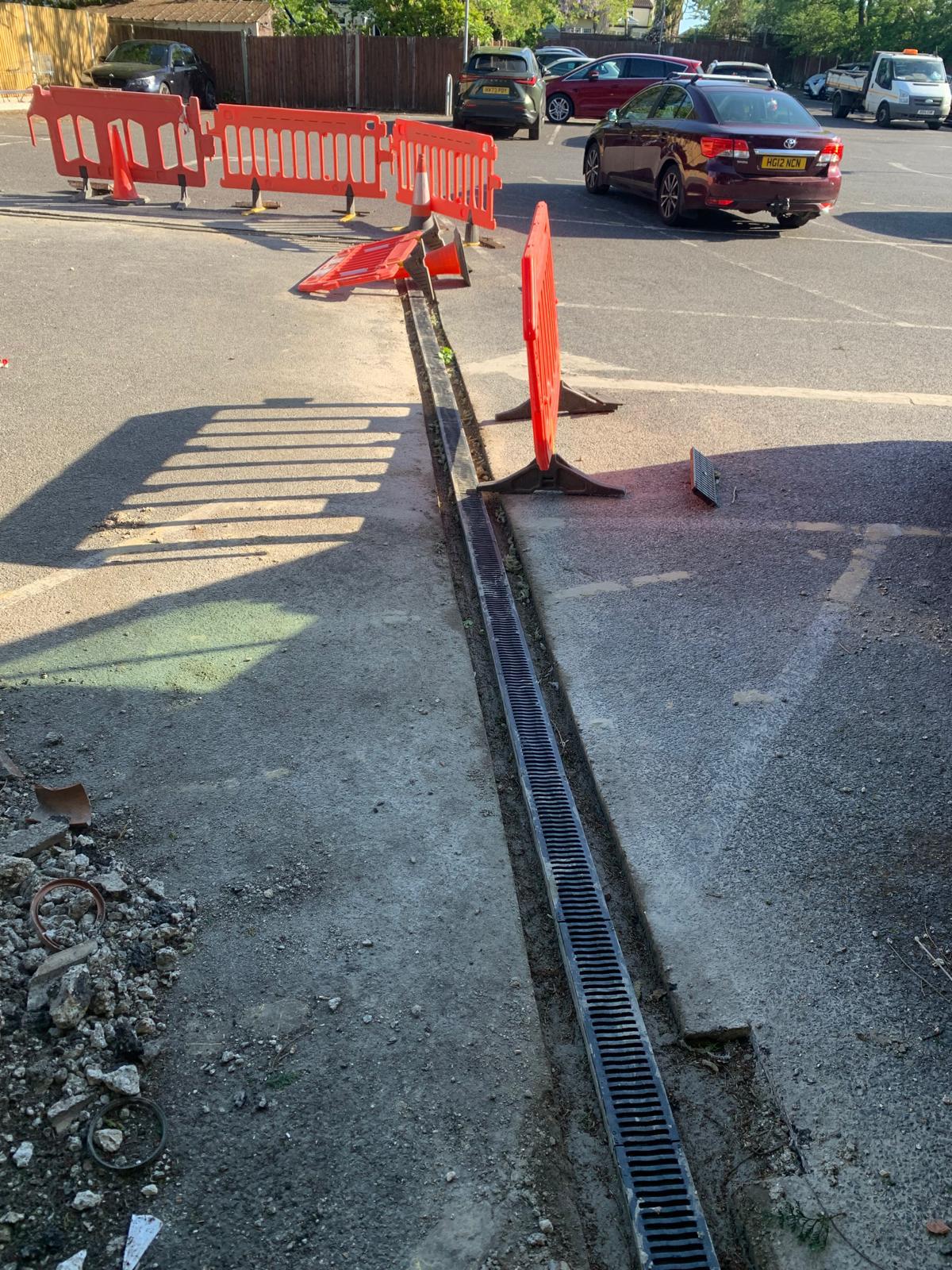 Commercial linear drainage channel installation in a car park to improve surface water drainage