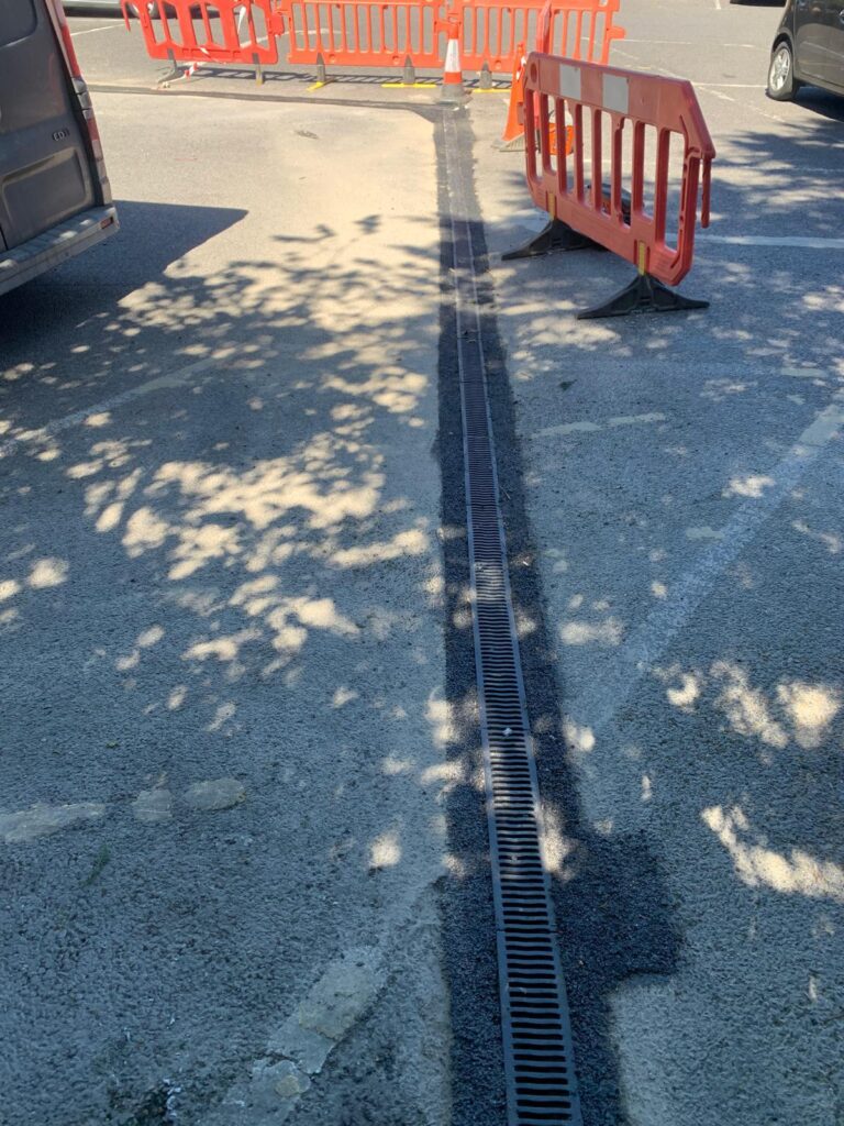 Linear drainage channel installation on commercial premises