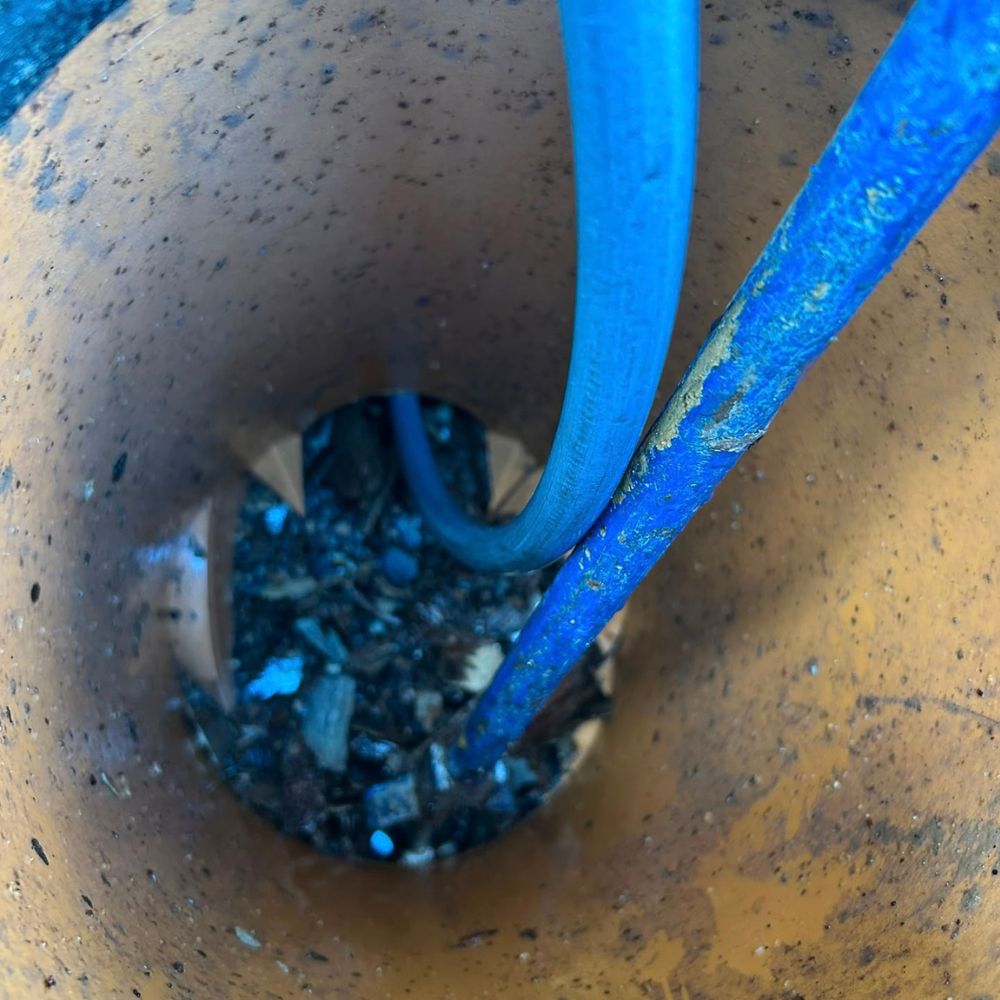 Drain clearance equipment being used through an inspection chamber