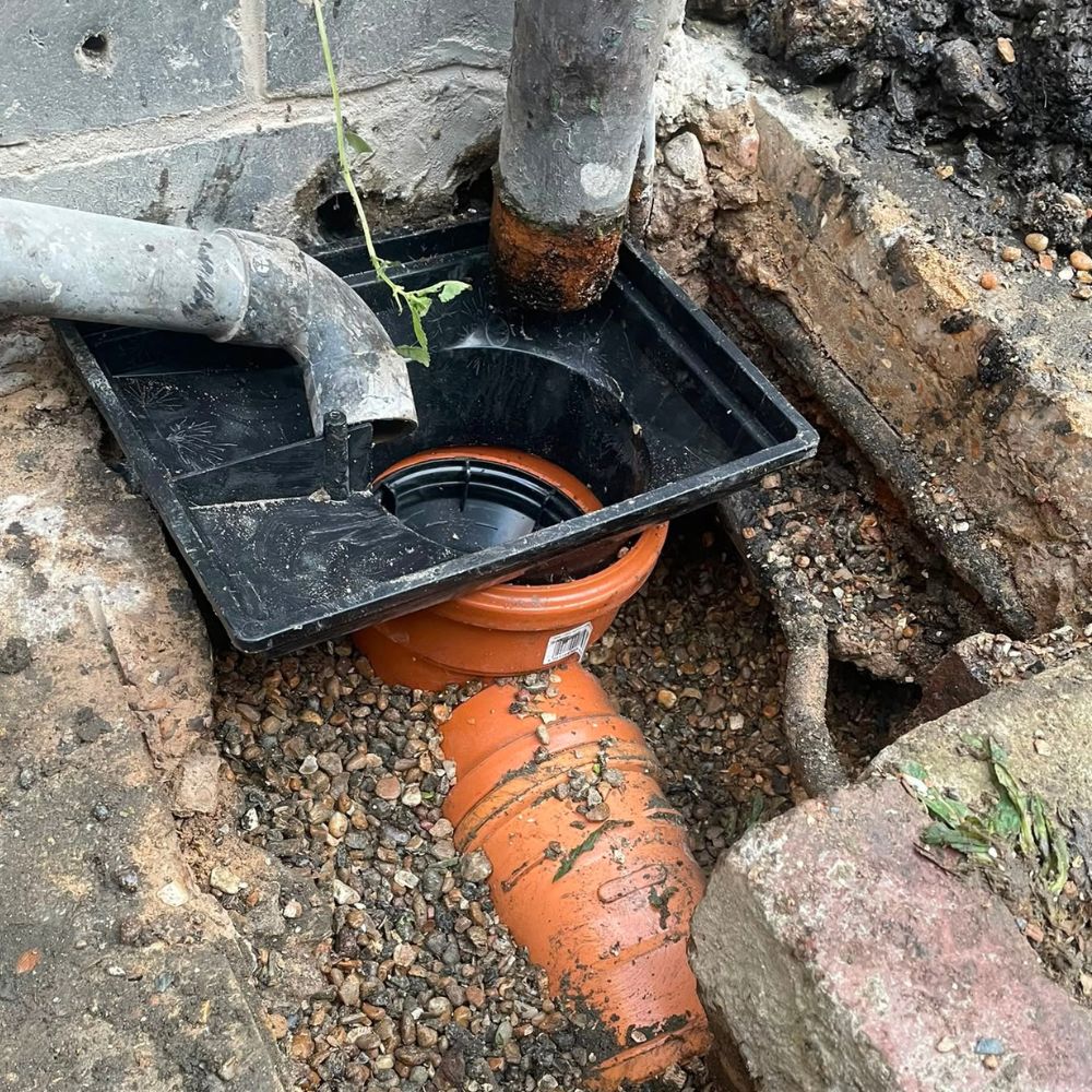 Underground drainage pipe exposed during drain repair work